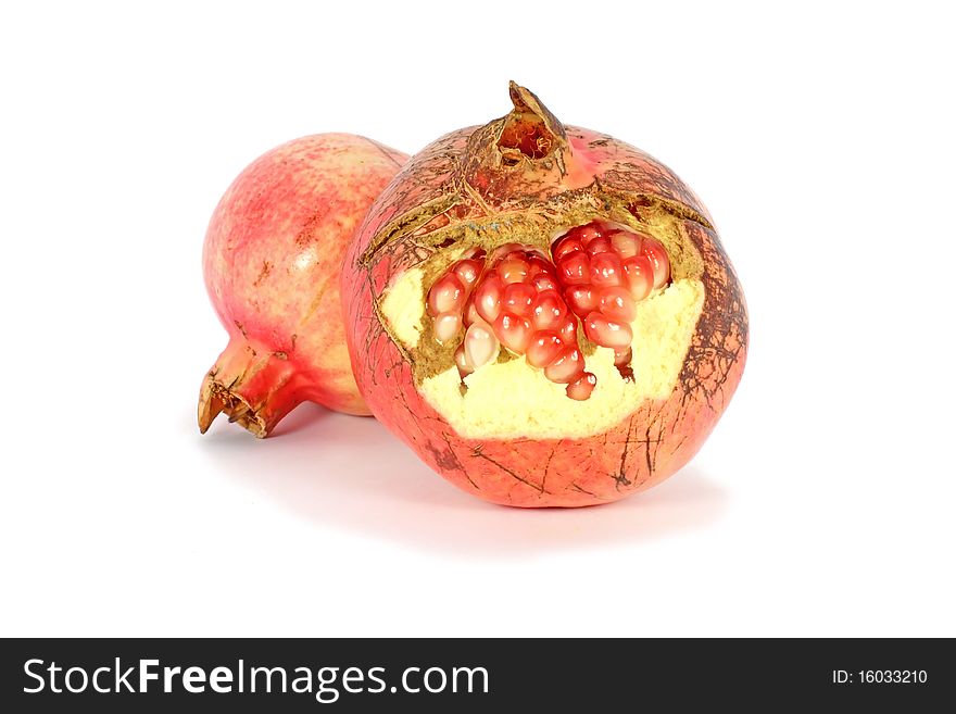 Ripe fresh pomegranate, isolated on white background