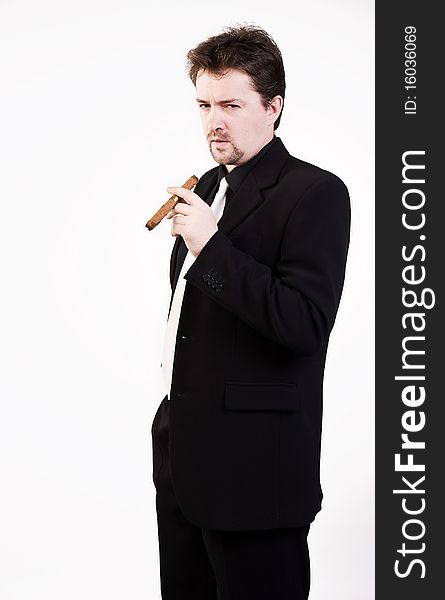 Business man in black suit with cigar. Business man in black suit with cigar