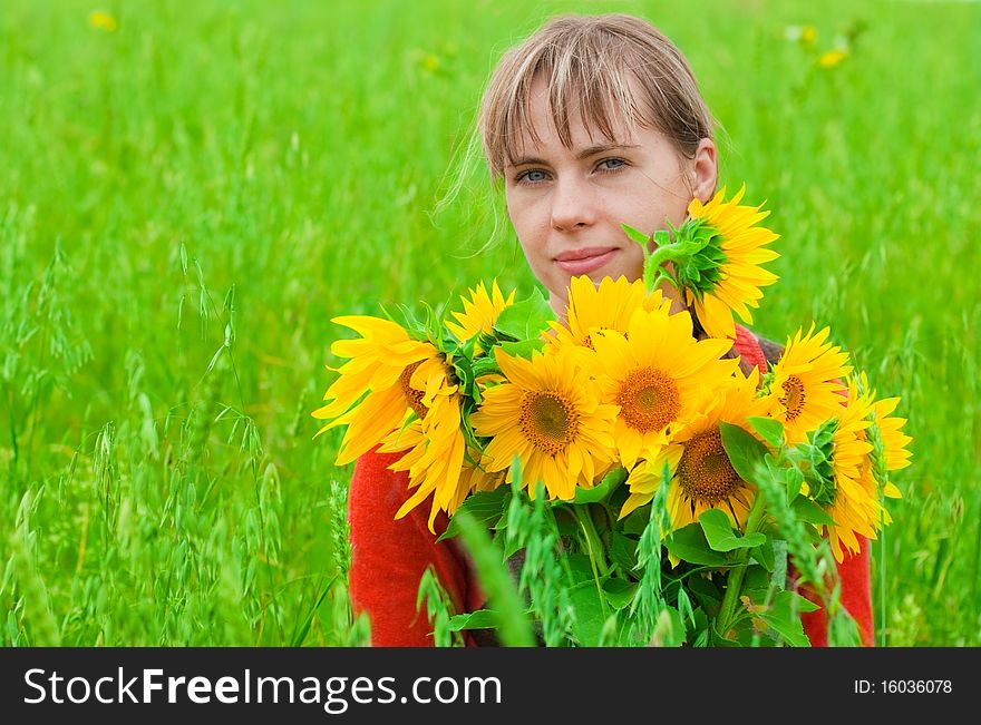 Girl with sunflower in hands