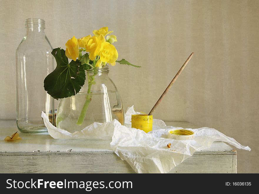 Still life with a yellow flower