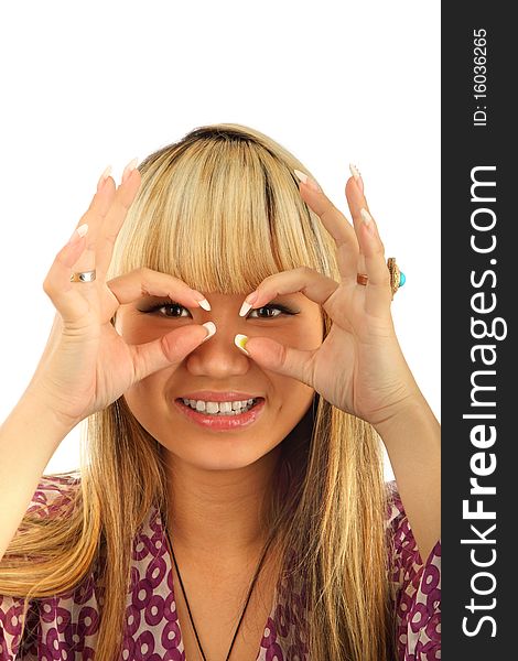 Happy young woman looking through circled finger isolated