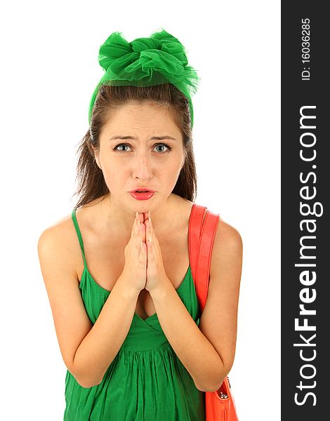 Closeup portrait of a young caucasian woman praying isolated