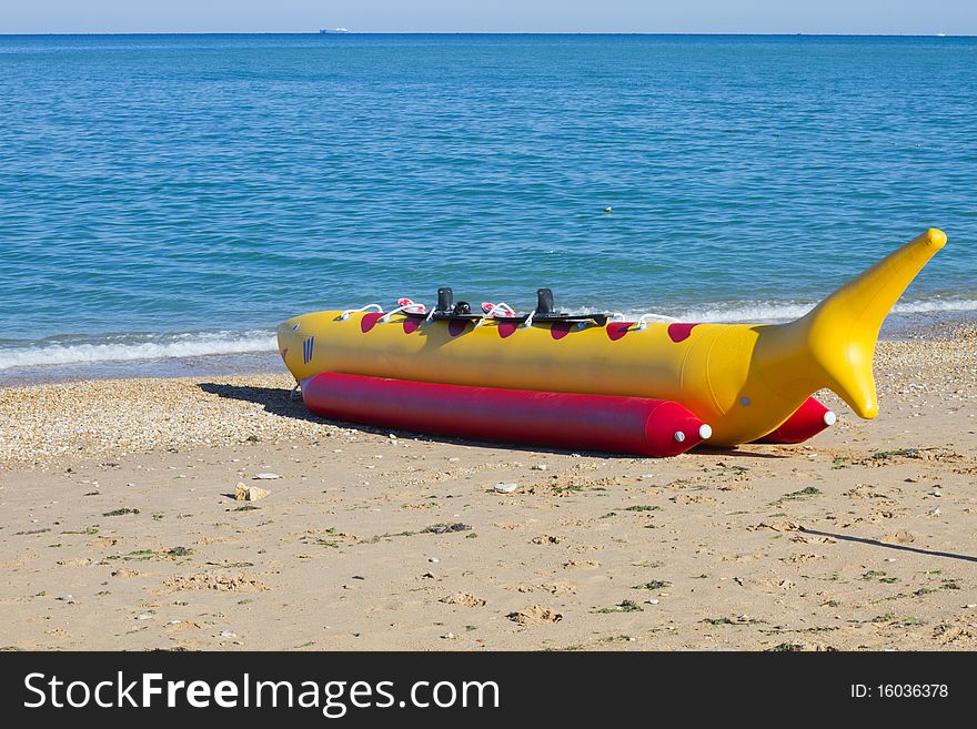 Banana boat as shark lays on a beach