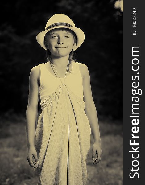Portrait of a funny smiling boy in a white hat outdoor. Portrait of a funny smiling boy in a white hat outdoor.