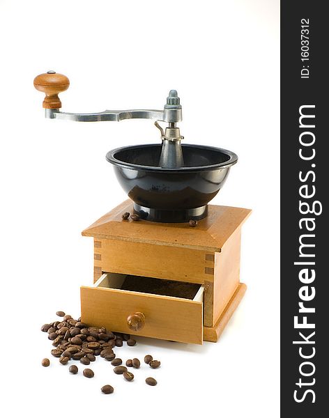 Coffee mill with beans on white background