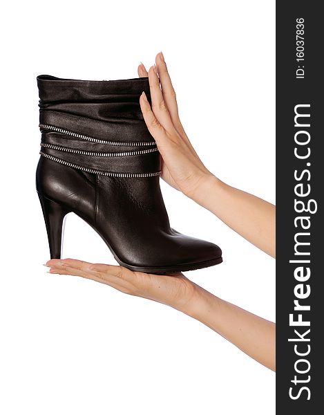 Black female boots in hands at the saleswoman. Black female boots in hands at the saleswoman