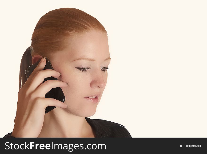 Young red haired lady talking on the phone. Young red haired lady talking on the phone