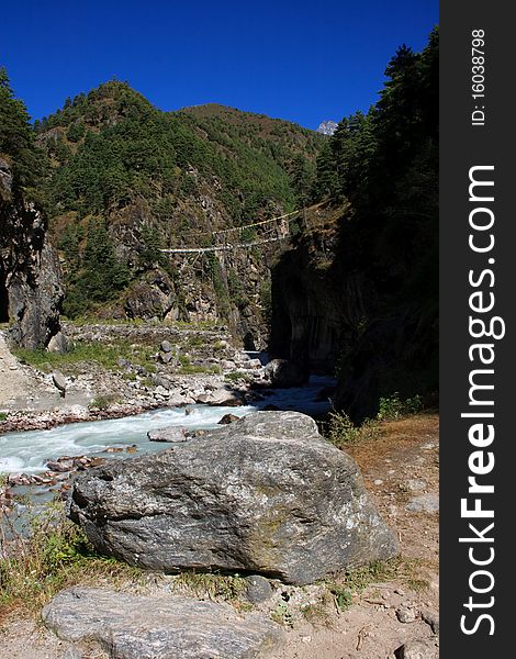 A foot bridge accross a river in the Himalayas. A foot bridge accross a river in the Himalayas