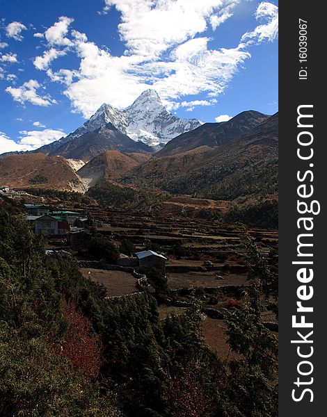 A small village in the shadow of the mountain peak Ama Dablam in the Himalayas, Nepal. A small village in the shadow of the mountain peak Ama Dablam in the Himalayas, Nepal.