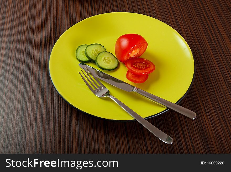 Vegetables on green plate on table