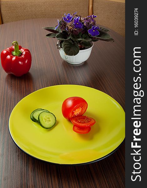 Vegetables on green plate on table