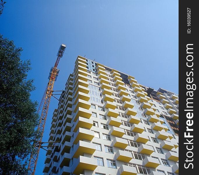 Under construction condo building against clear blue sky. Kyiv, Ukraine. Under construction condo building against clear blue sky. Kyiv, Ukraine.