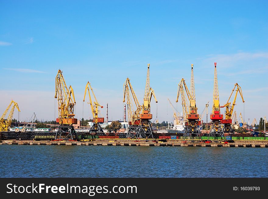 The review of a mooring of trading port with elevating cranes