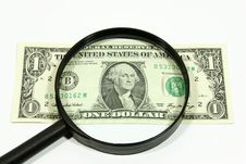 US Dollar With Magnifying Glass Royalty Free Stock Photos
