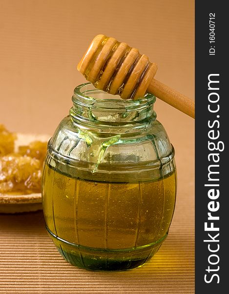 Honeycombs on a plate and jar of honey. Honeycombs on a plate and jar of honey