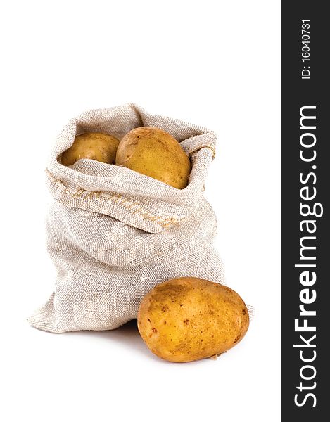 Burlap sack of potatoes isolated on white background