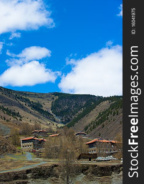 House and Mountain on blue sky background