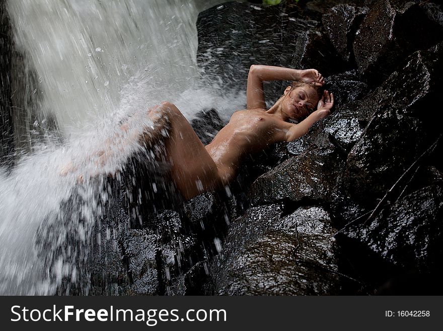 Young Nude Woman Swimming