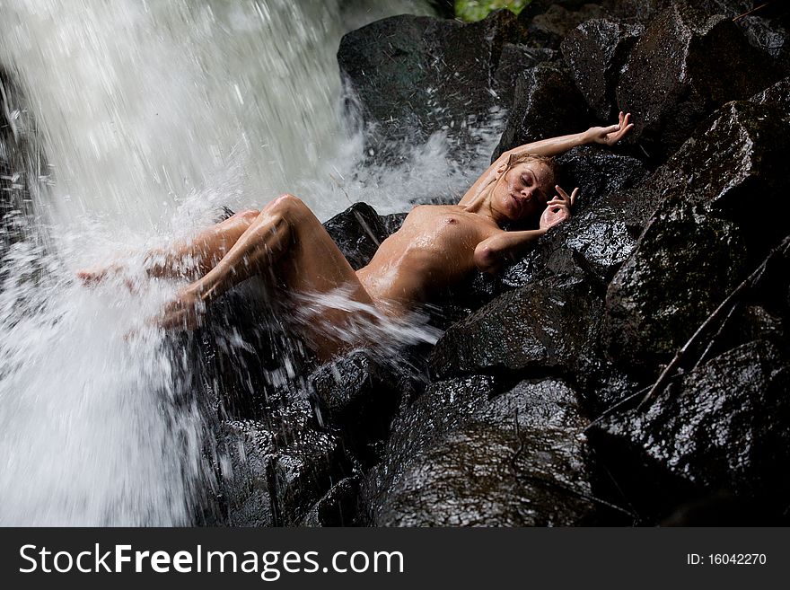 Young Nude Woman Swimming