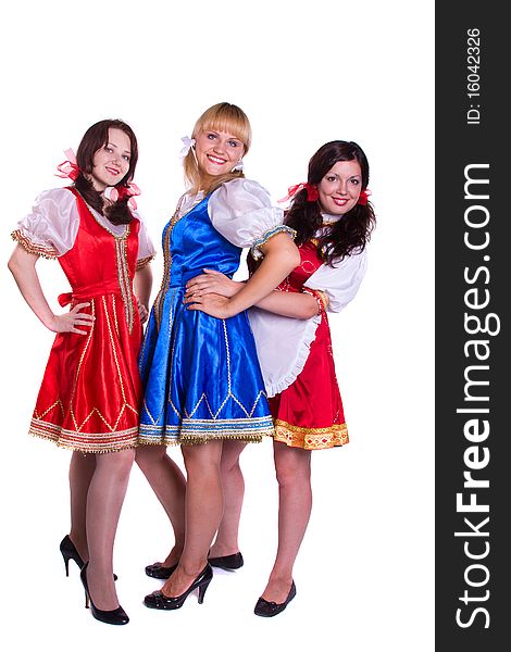 Three German/Bavarian girl s with a traditional Oktoberfest Ma?krug. Smiling woman in Bavarian drindl. Three German/Bavarian girl s with a traditional Oktoberfest Ma?krug. Smiling woman in Bavarian drindl