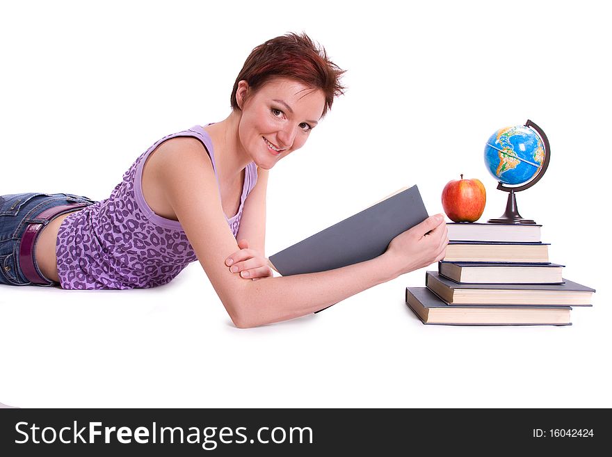 Girl doing her homework. Studying cheerful young woman reading her book for school. Woman with books. Girl doing her homework. Studying cheerful young woman reading her book for school. Woman with books