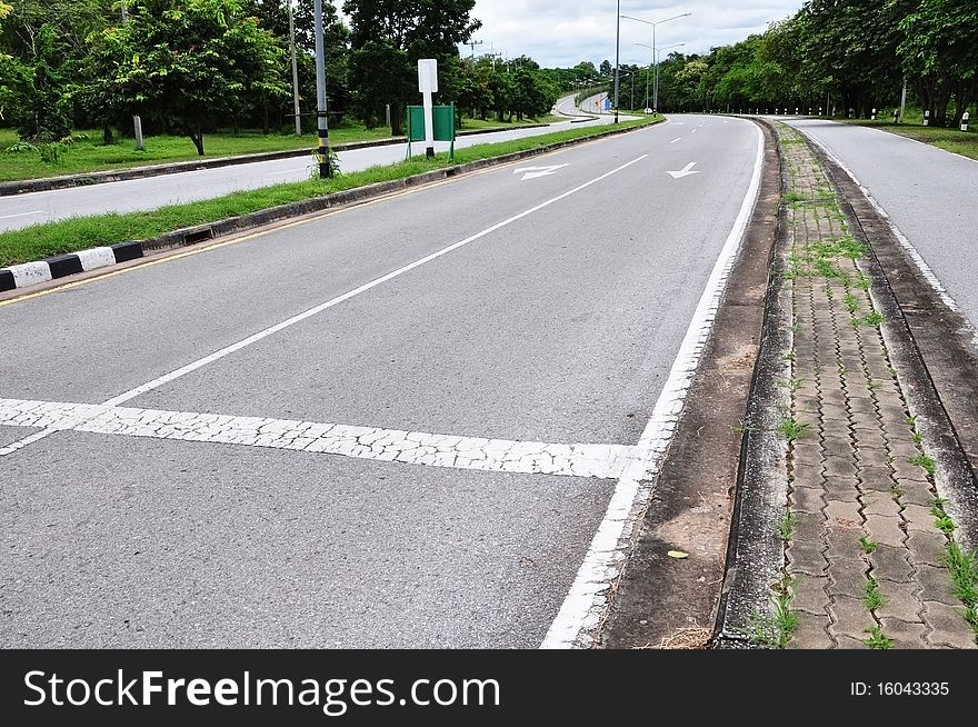 Arrow on asphalt road surface. Arrow on asphalt road surface