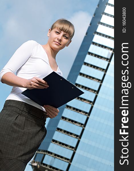 Beauty business woman on modern glass building with document