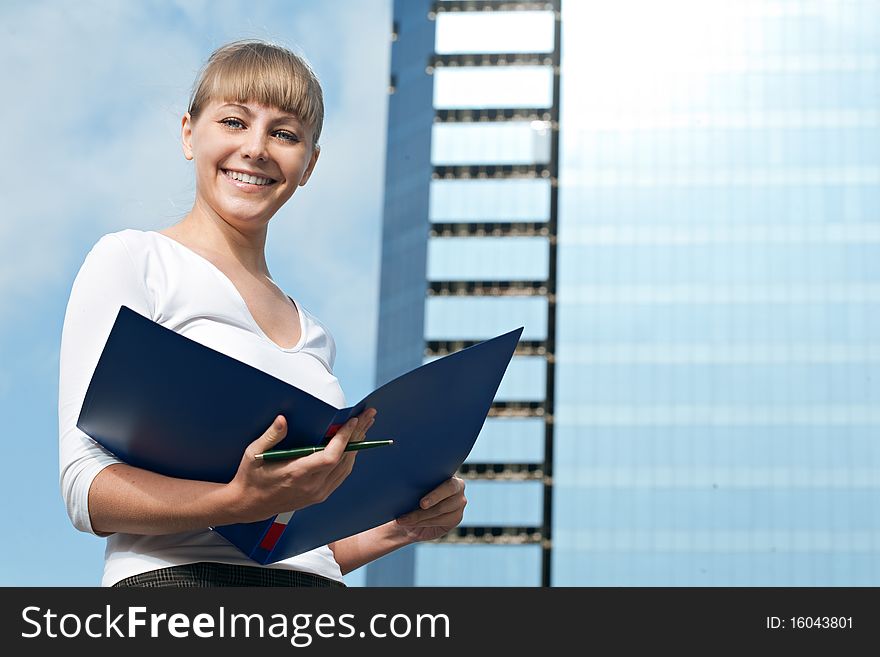 Beauty business woman on modern glass building with document