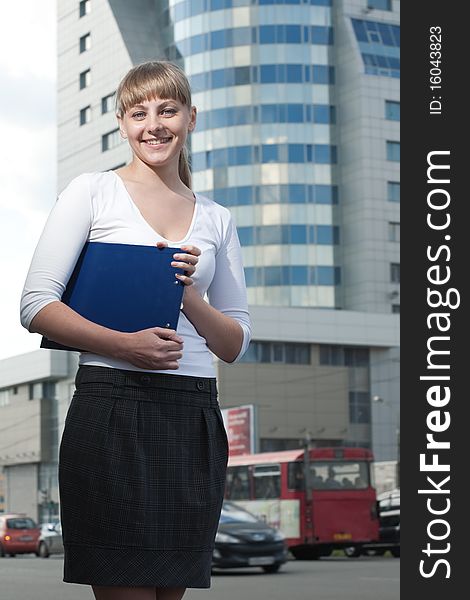 Beauty business woman on modern glass building with document