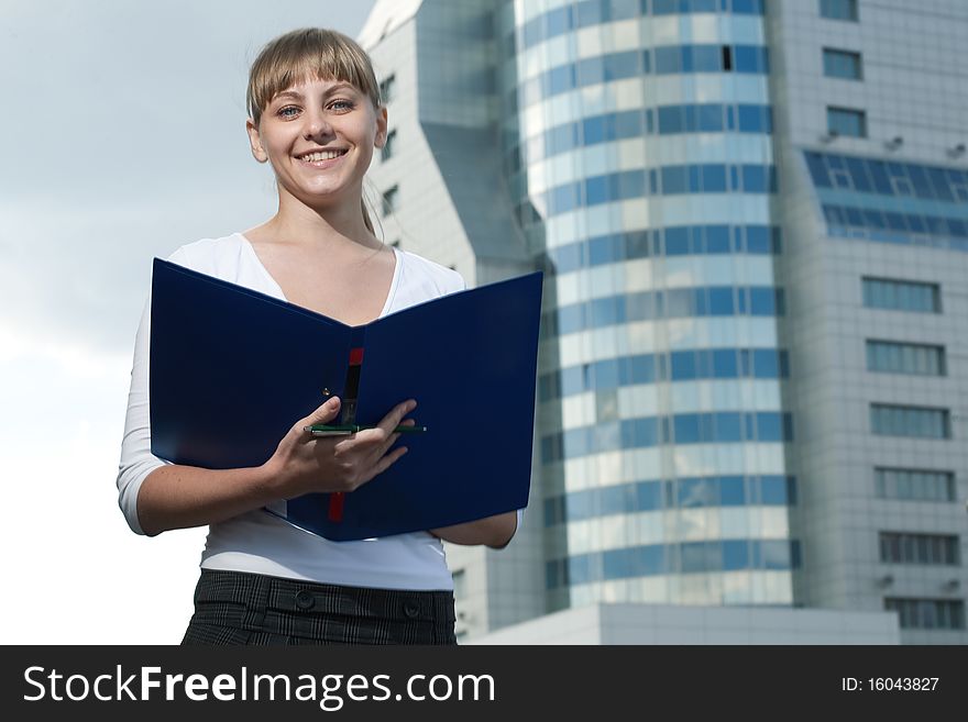 Beauty business woman on modern glass building with document