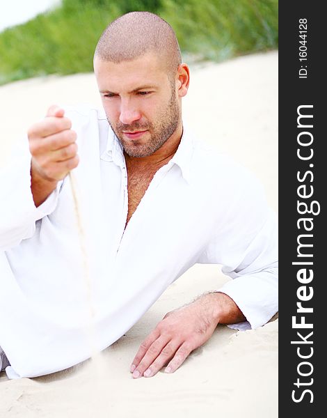 Attractive and happy man on the beach