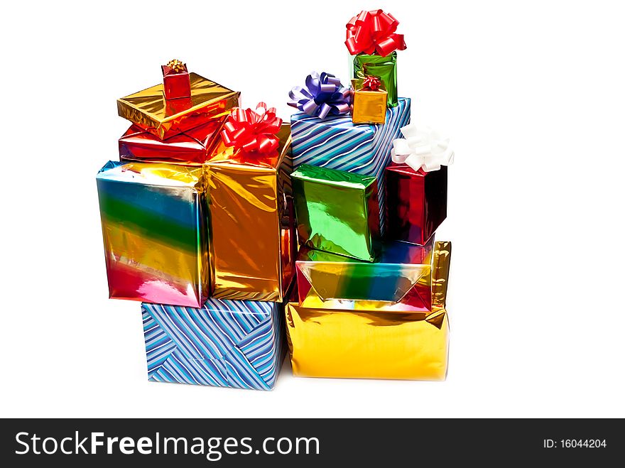 Stack of colored gift boxes with bows. Isolated on white. Stack of colored gift boxes with bows. Isolated on white