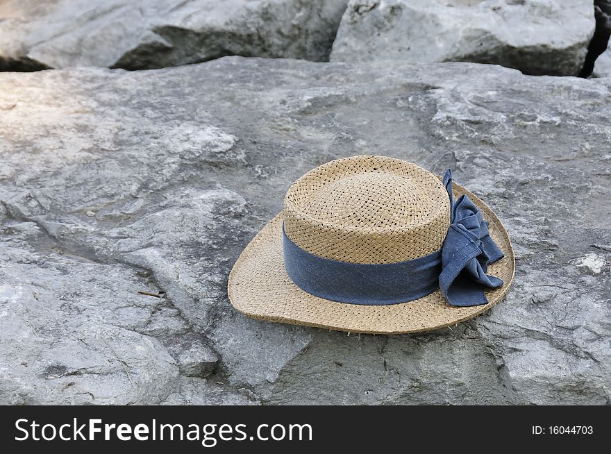 Straw bonnet on the rocks. Straw bonnet on the rocks