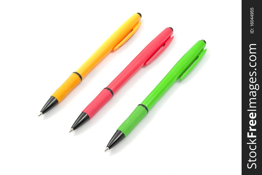 Colored pens on a white background