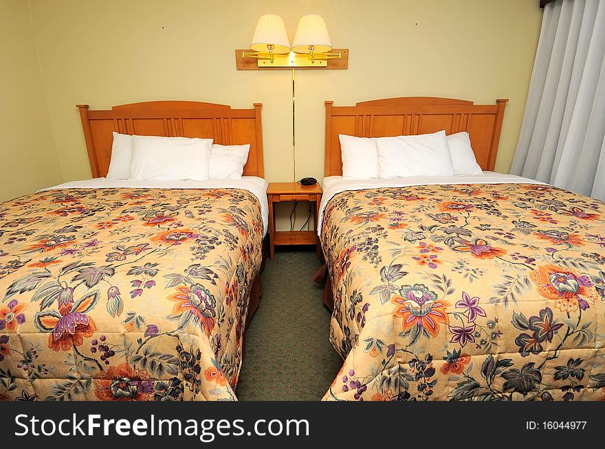 Front view of luxurious twin beds in high class resort.