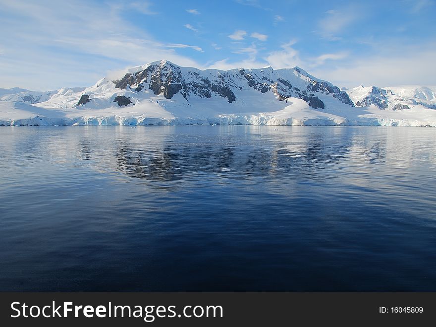View over the sea to the mainland of antarctica, blue sea and sun. View over the sea to the mainland of antarctica, blue sea and sun