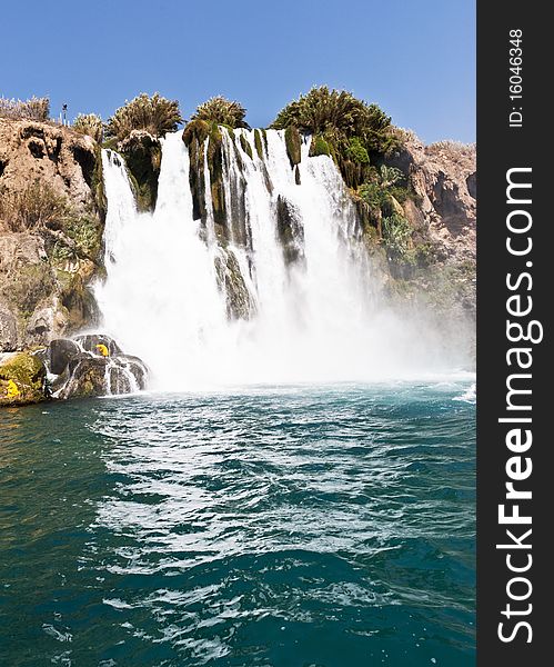 High waterfall flowing into the Sea