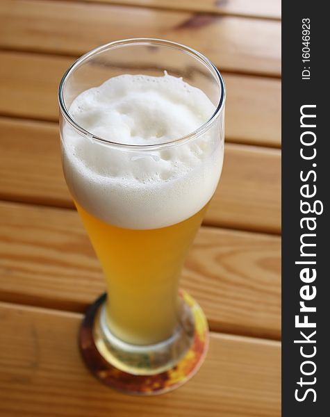 Beer In Glass On A Wooden Table