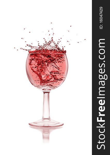 Studio photo of isolated glass with red wine splash