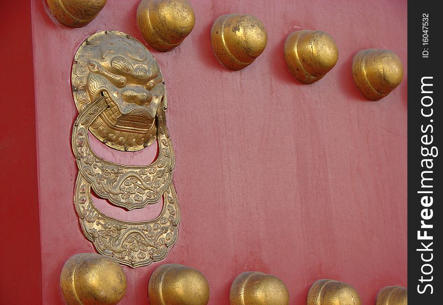 A red and gold door from the Forbidden City in Beijing,China.