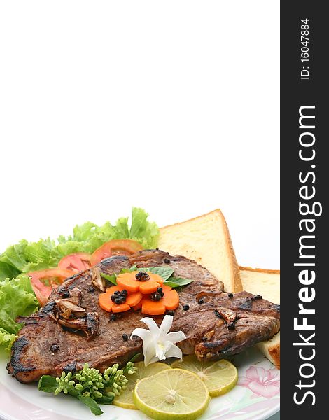 T Bone Pepper Steak with vegetable and bread, closeup