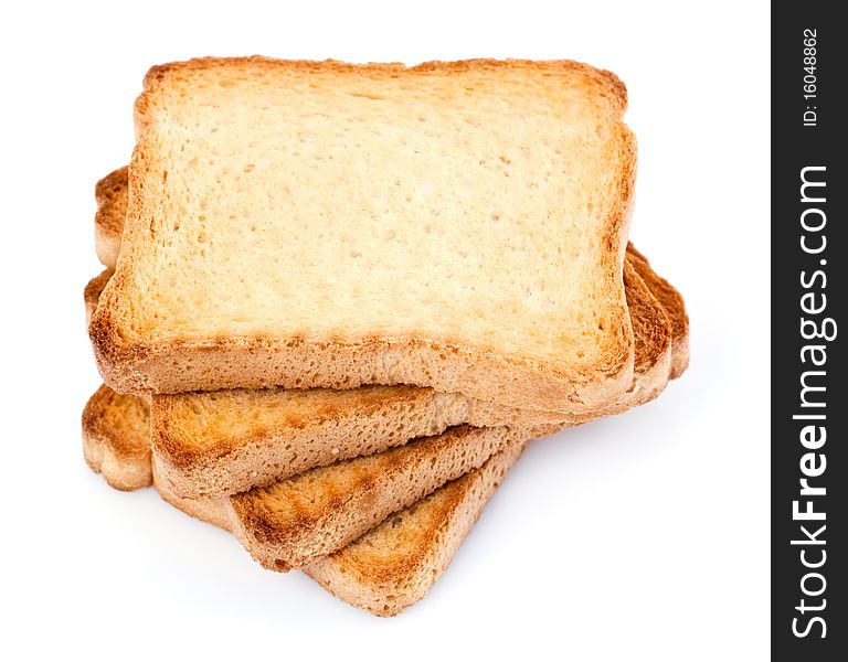 A pile of four toasted bread slices for breakfast isolated on white studio background.
