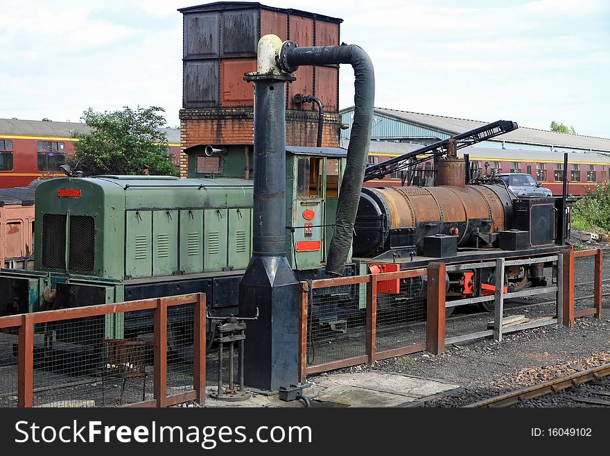 Diesil & steam locomotives sitting in railway siding at boness railway museum. Diesil & steam locomotives sitting in railway siding at boness railway museum