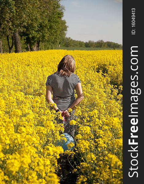 Girl walking through canola field. Girl walking through canola field