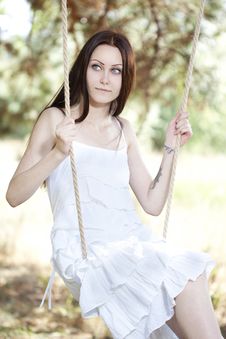 Young Woman Swinging Stock Images