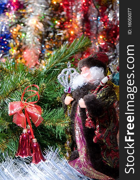 Santa Claus with gifts under a fur-tree