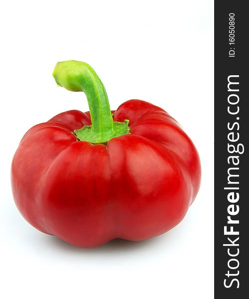 Beautiful red pepper close up on a white background. Beautiful red pepper close up on a white background