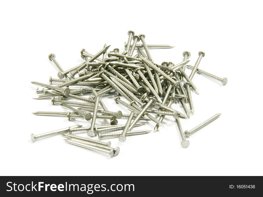 Place nails scattered on a white background.