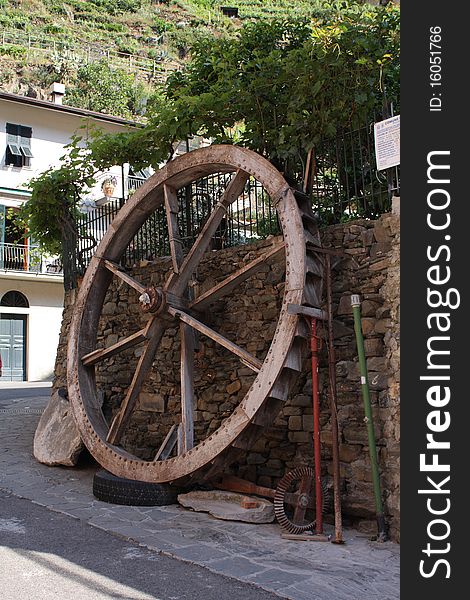 Old water wheel in small Italian village