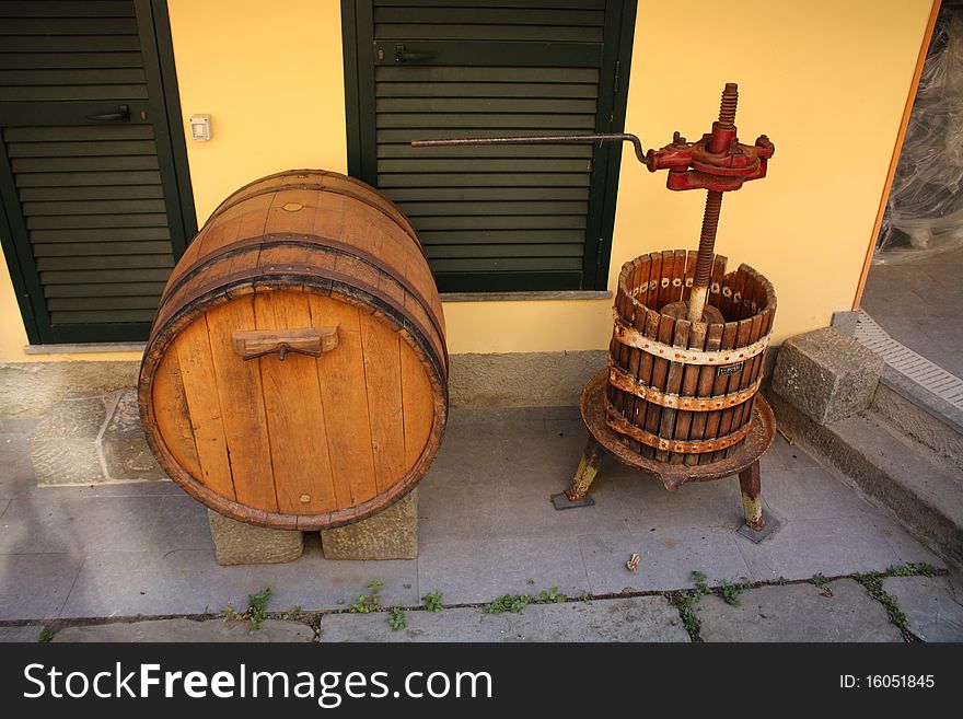 Wine barrel and press in small italian village